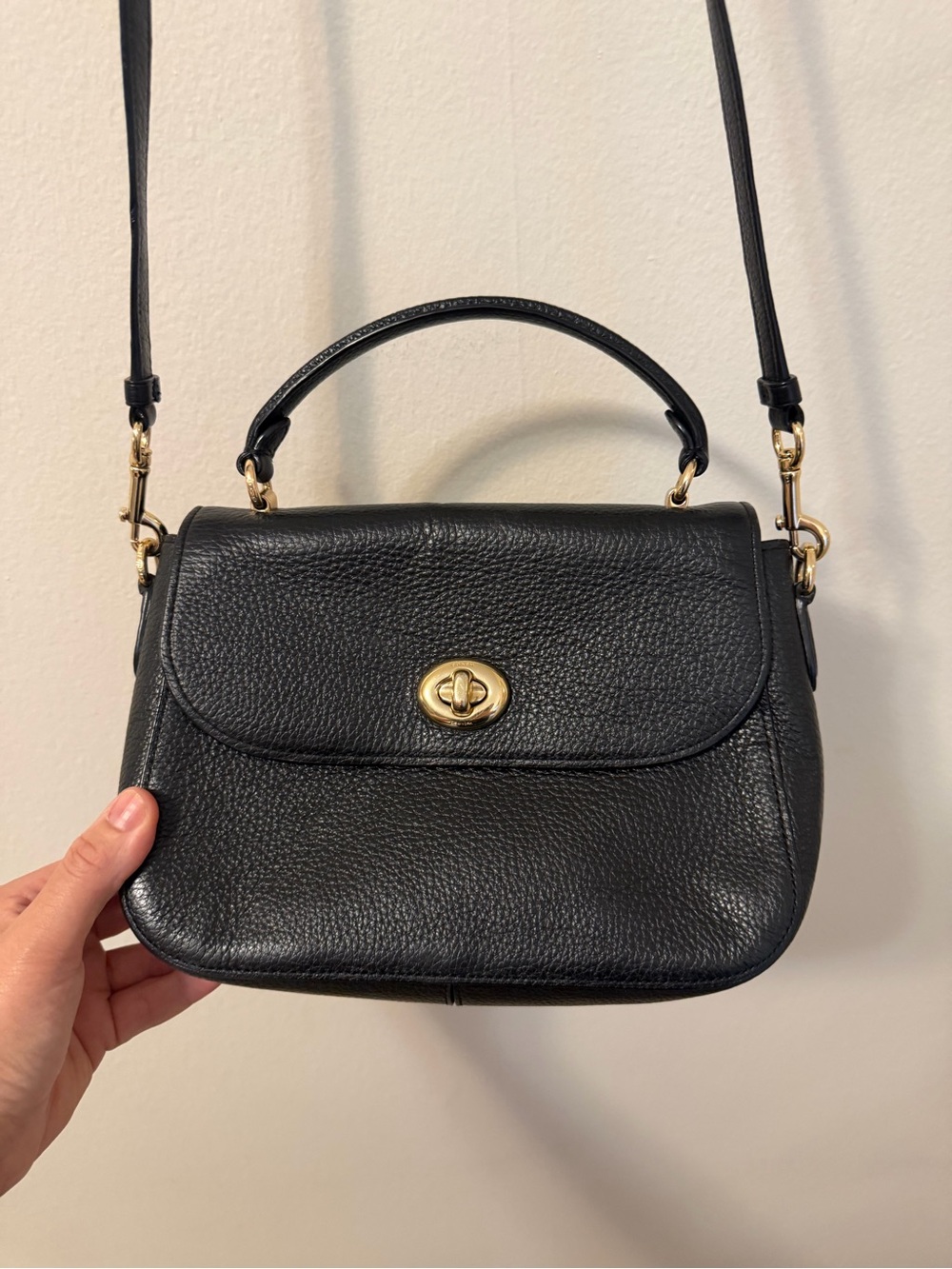 Timeless Coach crossbody with top handle. Authentic designer leather purse.